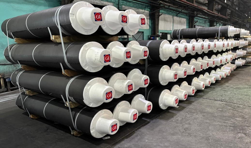 Finished graphite electrodes capped and packed for dispatch